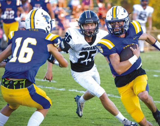 Bethel sophomore Bryce Tapley scrambles past Little Axe defender Jacek Graymountain-gross as BHS Freshman Kyler Spang moves into position to block the defender. Photo provided by Richelle Treece.