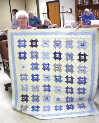 While recovering from an injury, 94-year-old Evelyn Pipkin received this “love quilt” from her fellow Spinning Spools Quilt Guild members. Pipkin said they are her family.