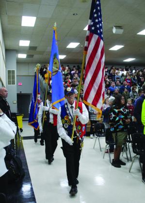 The CPN Veterans Association walks in to present the colors during the Tecumseh High School Veterans Day Program on Nov. 11. They include President Daryl Talbot, Kenny Reed, Bill Wano and Daniel Castaneda. They also performed a flag-folding ceremony. Countywide &amp; Sun/Natasha Dunagan