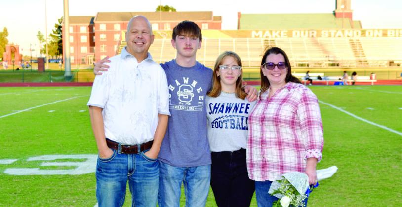 Shawnee Football Manager Leona Cole, third from left, is accompanied by her parents Jeremy and Amanda Cole, as well as her brother Bengi Cole. Leona has been a football manager since her freshman year. Leona is unsure of her plans after graduation, but says she is considering going to school to get her business degree. Photo provided by Cherity Pennington.