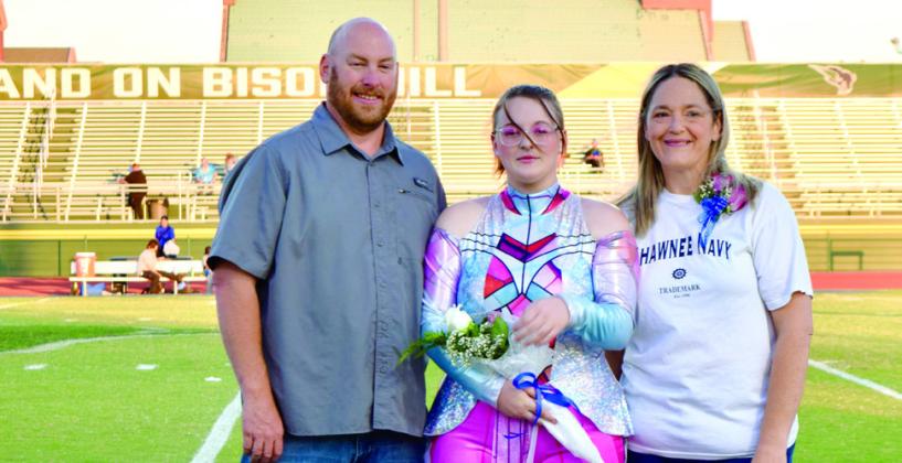 Shawnee Color Guard member Madison Drummond is joined by her parents, Mark and Jennifer Drummond. While in high school Madison was a member of the Marching band and Winter Guard. After graduation, Madison plans to go to college to be a vet tech. Photo provided by Cherity Pennington.