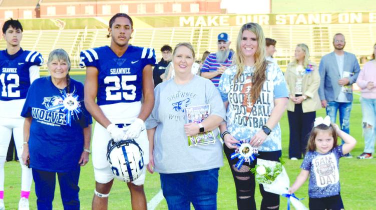 Shawnee Football Player Quentin Trapp is escorted by his mother Jennifer Trapp, grandmother Sherry Nettles, Aunt Amanda Molner, and cousin Olivia Molner. Quintin would also like to recognize his aunts Chastity, Tonya, and Shar. While in high school Quintin was in football and golf. After graduation, Quintin plans to go to college. Photo provided by Cherity Pennington.