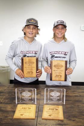 Madden McKiddy and Maddox Dickson, both of Tecumseh, pose with their fishing trophies for the Oklahoma TBF Junior Championship and the TBF Junior World Championship on Aug. 4. Countywide &amp; Sun/ Natasha Dunagan