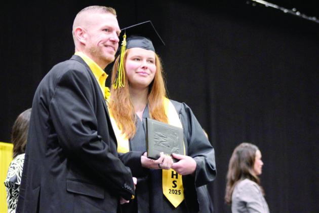 Tecumseh Board of Education member Shane Brown presents Jessica Jones with her diploma during Tecumseh's graduation on May 21 at FireLake Arena.. Jones served as one of our high school interns this semester at The Countywide &amp;amp; Sun. Natasha Dunagan, Countywide &amp;amp; Sun