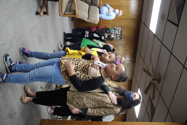 Nadine and Alexia Nsabimana lead the Pledge of Allegiance at the Shawnee Board of Education meeting Jan. 10.