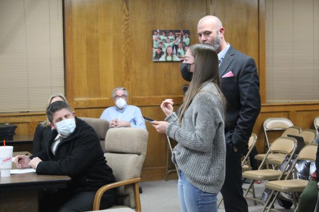 SHS senior Lillian Davis speaks about her high school experience and thanks the Shawnee Board of Education as Dr. Aaron Espolt and SHS Principal Matt Johnson look on at the meeting Jan. 10.
