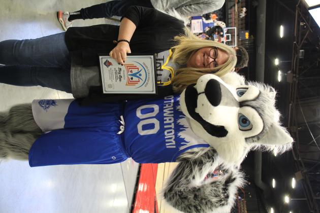 Teacher Stacy Kipps with Mo the Fire Wolf