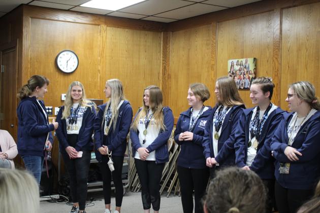 Coach Valarie Colburn introduces the Swim Team members.