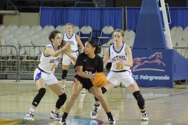 Baylee Tapley, Josie Megehee on defense