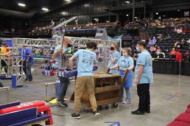 The Sprockets load up their robot.