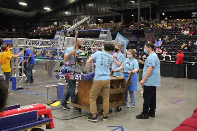 The Sprockets load up their robot.