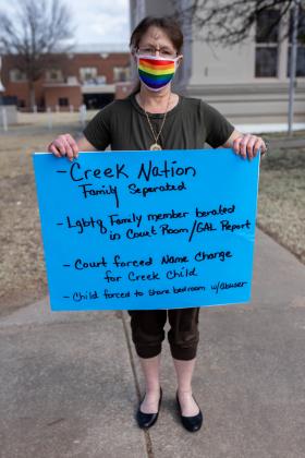 Protesters show their opposition to DA Alan Grubb and corruption.