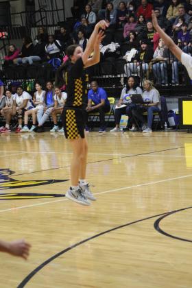 Tecumseh junior Kenzli Warden shoots for three during the Feb. 26 Regional game against Classen. Warden reached 1,000 points during the Byng Tournament on Jan. 21, and has since climbed to 1,154 points. Countywide &amp; Sun/Natasha Dunagan