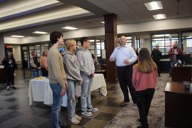 Casey Bell with four members of the BancFirst Student Board