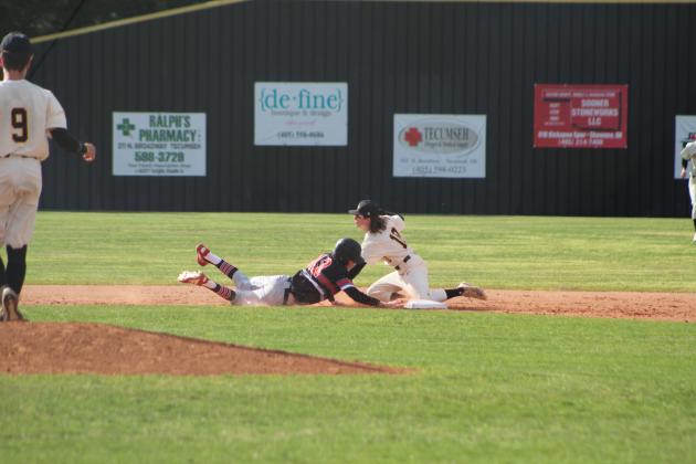 Tecumseh sophomore Rowdy Kinsey tags a runner at second base during the first inning of the home game against Hilldale on April 7. Tecumseh lost 1-9. Countywide &amp; Sun/Natasha Dunagan