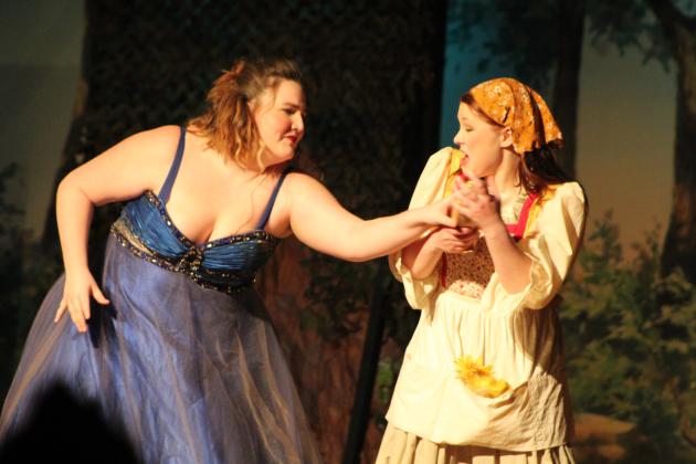 Cinderella and the Baker's Wife fight over a golden slipper.