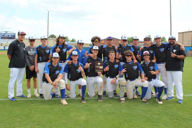 Bethel Wildcats pose with their District Championship trophy.
