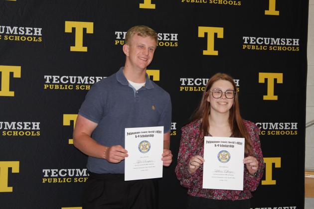 Tyler Sampson and Lillian Effinger pose with their Pottawatomie County Sheriff's Office K-9 Scholarships.