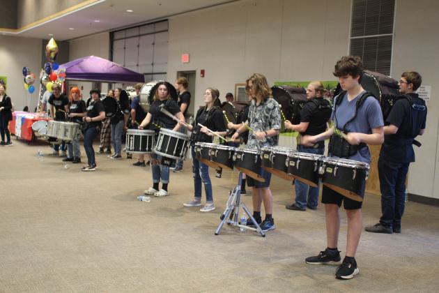 The Tecumseh High School Drum Line performs.