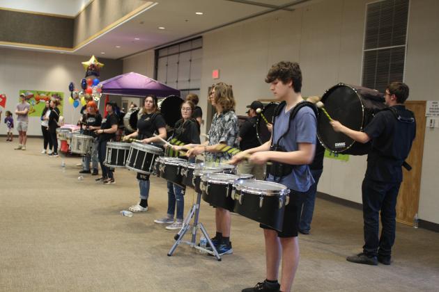 The Tecumseh High School Drum Line performs.