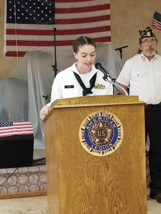US Naval Sea Cadet Anna O'Dell reads "The Old, Rugged Flag."