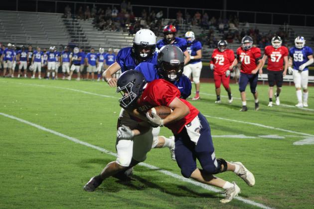 Minco graduate Will Holding gains some yardage for the North Team during the Second Annual CPN All-Star Bowl at OBU on June 3. The North Team also included two players from North Rock Creek - Jayce Williams and Colton Burch - and one from McLoud, Rylan Hall-Norton.
