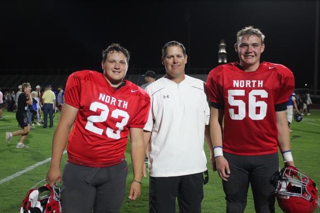 Following the Second Annual CPN All-Star Bowl, North Rock Creek Head Football Coach Jason Murray poses with his players Jayce Williams, far left, and Colton Burch who both played on the North Team.