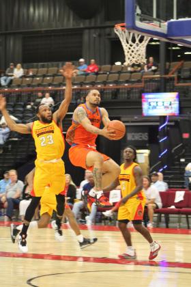 Potawatomi Fire Point Guard Deshawn Munson focuses on the basket and makes his shot during the first Second-Round Playoff game against the Shreveport Mavericks on June 8 at FireLake Arena. The Fire won that game 113-100, but they lost the next two games in Shreveport - 107-120 on June 10, and 110-120 on June 11 - to end their inaugural season.