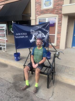 Brandon Taber won the 140 mile Fenrir Unchained Bike Race in Tecumseh on June 4. He posed for his winning photo on the throne constructed from bicycle parts by spOKeLAHOMA owner, Craig MacIntyre. Photo provided.