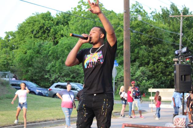 Damian Phillips, aka Young Dame, performs a rap aimed at children.