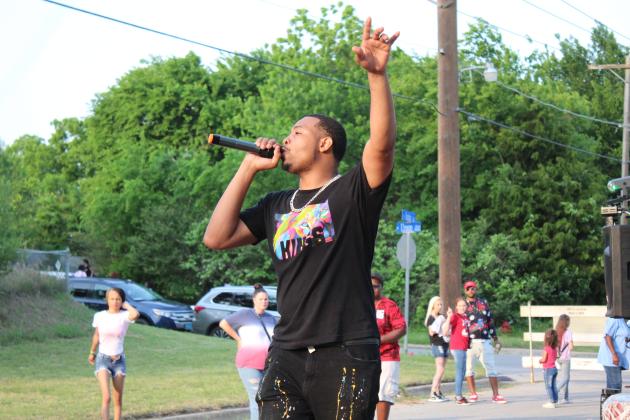 Damian Phillips, aka Young Dame, performs a rap aimed at children.