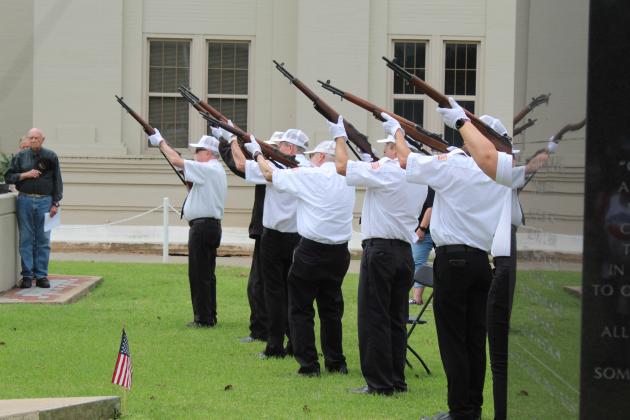 The VFW Post 1317 Honor Guard gives the 21-gun salute.