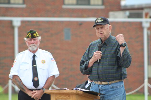 Veterans Memorial Committee member Al Brase speaks as VFW Post 1317 Commander-elect Patrick "Gunny" Koch looks on.