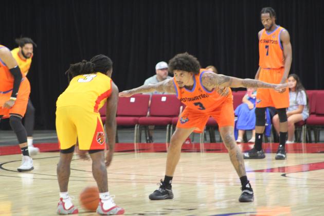 Deon Lyle on defense.