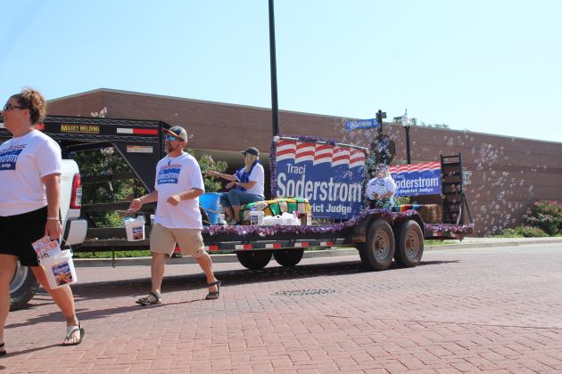A float for District Judge candidate Traci Soderstrom pumps out bubbles as family and friends of Soderstrom hand out information, bottled water and candy during the Juneteenth Parade in downtown Shawnee on June 18.