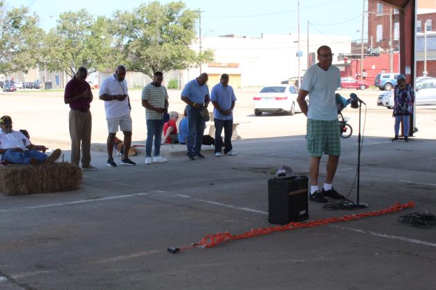 Pastor Joe Wilkes leads a prayer for the military.