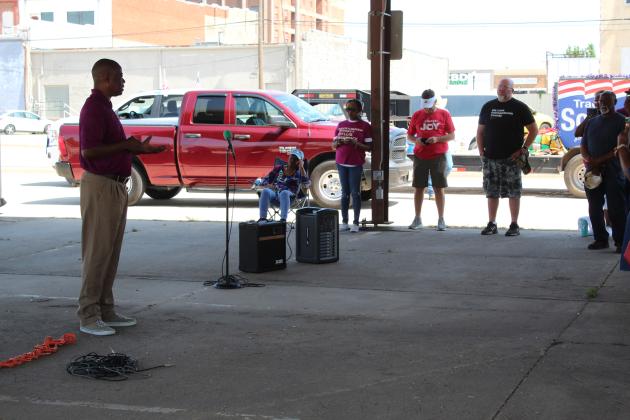 Pastor David Henry leads a prayer for the justice system.