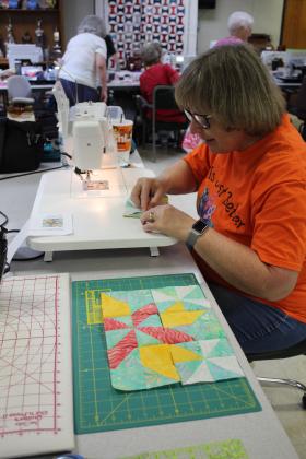 Gretchen Gaskill sews quilt squares at Quilt Camp.