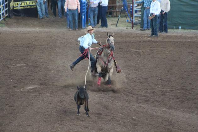 Blake Carter, of Seminole, steps off of his horse during the Calf Roping event of the IFYR on July 11 at the Heart of Oklahoma Expo Center.