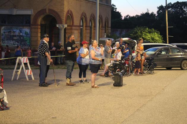 eresa Tecumseh sings the national anthem at Wanette's Independence Day event on July 4, as she has for the past 13 years. Behind her, from left, are Rev. Frank Sturgill, Mayor Nathan Gregory, and City Trustee Angela Larman. Countywide &amp; Sun/Natasha Dunagan