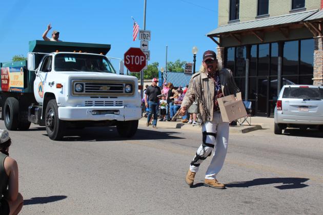 Vegas Joe X, aka Bradley Weldon of McLoud (not Joe Exotic), greets festival-goers along the McLoud Blackberry Festival parade route on July 9. Countywide &amp; Sun/Natasha Dunagan