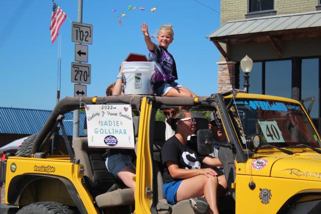 Blackberry Junior Princess Candidate Sadie Gollihar throws candy.
