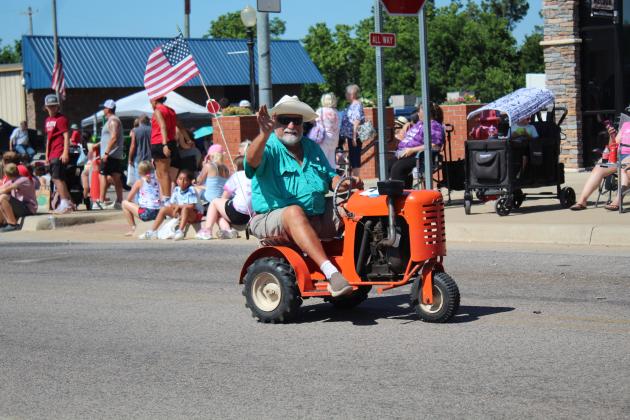 Danny Dunagan drives his miniature tractor in the Blackberry Festival Parade.