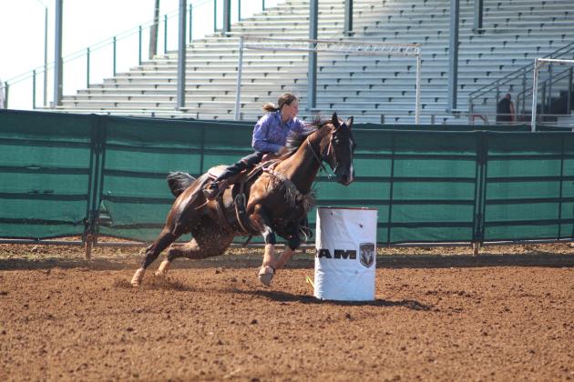 Jessica Staff, of Tecumseh, rounds the second barrel in the IFYR Barrel Racing event on the morning of July 15. Countywide &amp; Sun/Natasha Dunagan