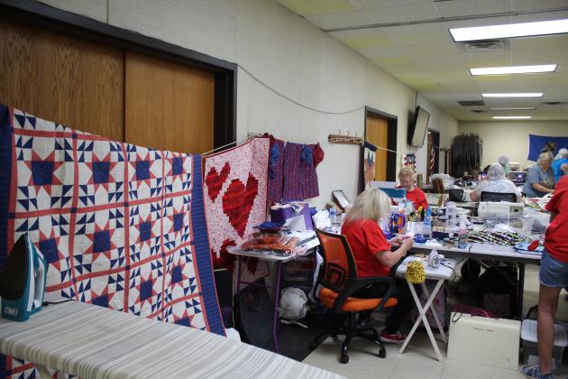 Carol Cramer-Short and June Cramer, both of Stillwater, work on quilting projects at Quilt Camp on June 25.