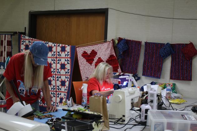 Carol Cramer-Short, right, and her sister, both of Stillwater, work on quilting projects at Quilt Camp on June 25.
