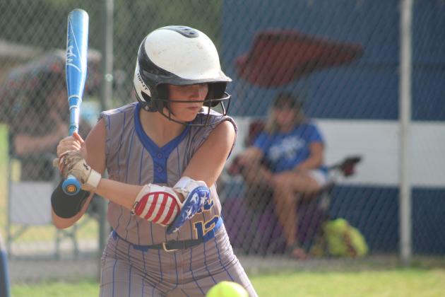 Bethel Lady Wildcat Alexis Williams keeps her eye on the ball during the game against the SouthMoore Sabercats on Aug. 8. After a delay for rain, SouthMoore won 10-0. Countywide &amp; Sun/Natasha Dunagan
