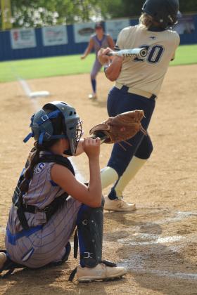 Bethel catcher Layla Menhusen grabs for the ball, but it was hit by the SouthMoore batter during the first fastpitch home game on Aug. 8. After a delay for rain, SouthMoore won 10-0. Countywide &amp; Sun/Natasha Dunagan