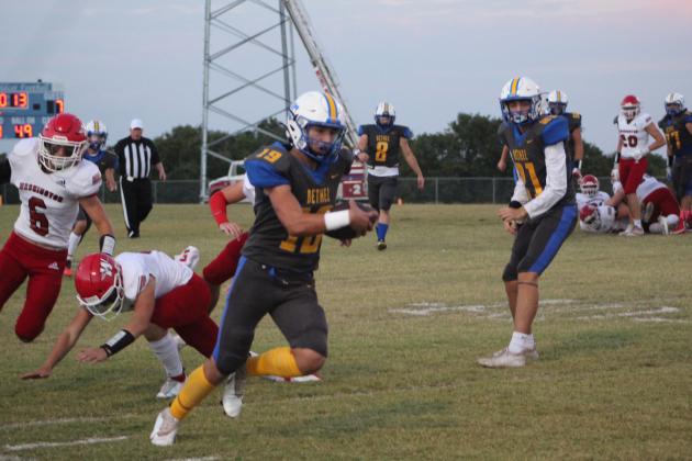 Bethel senior John Gordon carries the ball and dodges Washington players during the Homecoming Game on Oct. 1, 2021. Countywide &amp; Sun/Natasha Dunagan