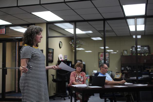 Bethel Teacher Alicia Gardner speaks to the Bethel Board of Education during the meeting on Aug. 8, as Minutes Clerk Denise Flowers and Superintendent Dr. Matt Posey listen. Countywide &amp; Sun/Natasha Dunagan